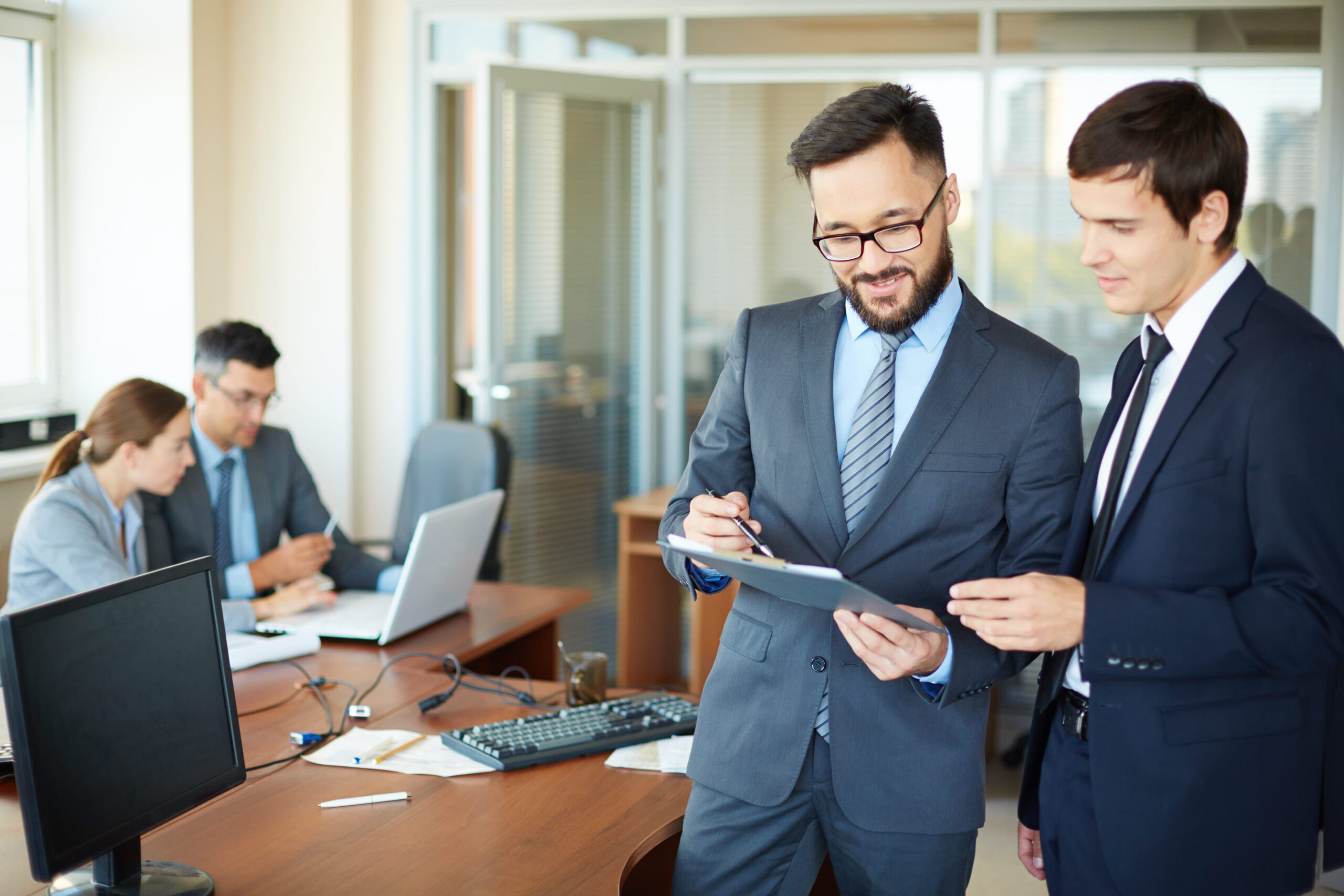 successful-businessmen-talking-each-other (1)